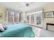 Bright bedroom with a ceiling fan, large windows, and access to a private balcony at 76527 Rice, Chapel Hill, NC 27517