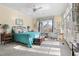 Bright bedroom with a ceiling fan, large windows, and access to a private balcony at 76527 Rice, Chapel Hill, NC 27517