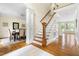 Hardwood staircase with white risers and decorative trim leading to the second floor at 76527 Rice, Chapel Hill, NC 27517