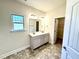 Double vanity bathroom with tiled floors at 78 Falls Of The Cape Dr, Lillington, NC 27546