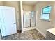 Modern bathroom with a large shower and tile floors at 78 Falls Of The Cape Dr, Lillington, NC 27546