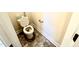 Clean and simple half bathroom with tile floor at 78 Falls Of The Cape Dr, Lillington, NC 27546