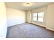 Simple bedroom with neutral walls and carpet at 78 Falls Of The Cape Dr, Lillington, NC 27546