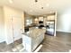Modern kitchen with an island and stainless steel appliances at 78 Falls Of The Cape Dr, Lillington, NC 27546