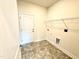 Laundry room with shelving and tile floor at 78 Falls Of The Cape Dr, Lillington, NC 27546