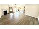 Open living room with fireplace and hardwood floors at 78 Falls Of The Cape Dr, Lillington, NC 27546