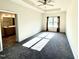 Large bedroom with carpeted floors and ceiling fan at 78 Falls Of The Cape Dr, Lillington, NC 27546