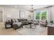 Relaxing sitting room with a gray sectional sofa and a stylish coffee table at 802 Brookfield Dr, Gibsonville, NC 27249