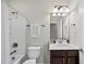 Clean bathroom with a tub, shower, vanity, and updated fixtures at 821 Blackfriars Loop, Cary, NC 27519