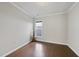 Spacious bedroom with hardwood floors and a large window at 821 Blackfriars Loop, Cary, NC 27519