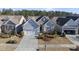 Gray two-story house with a two-car garage and manicured landscaping at 821 Blackfriars Loop, Cary, NC 27519