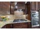 Modern kitchen with gas cooktop and double ovens at 821 Blackfriars Loop, Cary, NC 27519