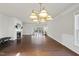 Living room with hardwood floors, fireplace and access to patio at 821 Blackfriars Loop, Cary, NC 27519