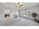 Main bedroom with carpet, ceiling fan and large windows at 821 Blackfriars Loop, Cary, NC 27519