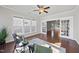 Sunroom with hardwood floors, a ceiling fan and French doors at 821 Blackfriars Loop, Cary, NC 27519