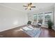 Bright sunroom with hardwood floors and access to a deck at 821 Blackfriars Loop, Cary, NC 27519