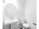 Clean half bathroom featuring white vanity and fixtures at 1029 Dillon Lake Dr, Knightdale, NC 27545