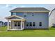 Exterior shot showing a backyard patio and second story on home at 1029 Dillon Lake Dr, Knightdale, NC 27545