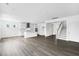 Open-concept living space features the kitchen, modern flooring, staircase, and plenty of natural light at 1029 Dillon Lake Dr, Knightdale, NC 27545