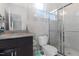 Modern bathroom with a glass shower, vanity with quartz countertop, and toilet at 1040 Myers Point Dr, Morrisville, NC 27560