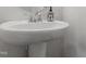 Clean and simple bathroom with pedestal sink and chrome fixtures at 1040 Myers Point Dr, Morrisville, NC 27560