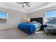Relaxing main bedroom with a king-size bed, two night stands, and ample natural light at 1040 Myers Point Dr, Morrisville, NC 27560
