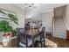 Bright dining area with four-chair table, and views into the kitchen and living areas at 1040 Myers Point Dr, Morrisville, NC 27560