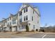 Three-story townhome with two-car garage and curb appeal at 1040 Myers Point Dr, Morrisville, NC 27560