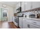 Well-equipped kitchen featuring stainless steel appliances and gray cabinets at 1040 Myers Point Dr, Morrisville, NC 27560