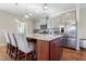 Modern kitchen with stainless steel appliances and a large island with seating at 1040 Myers Point Dr, Morrisville, NC 27560