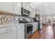 Modern kitchen with stainless steel appliances and granite countertops at 1040 Myers Point Dr, Morrisville, NC 27560