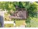 Aerial view of a house with brown roof and yard at 105 Cooke St, Raleigh, NC 27601