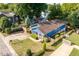 Aerial view of a blue house with a yard and fence at 105 Cooke St, Raleigh, NC 27601