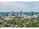 Panoramic aerial view of a city skyline with lush green trees and buildings at 105 Cooke St, Raleigh, NC 27601
