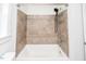 Bathroom with tiled shower and tub at 105 Cooke St, Raleigh, NC 27601