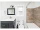 Bathroom with tub, shower, vanity, and tile at 105 Cooke St, Raleigh, NC 27601