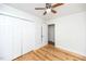Bedroom with hardwood floors, ceiling fan and closet at 105 Cooke St, Raleigh, NC 27601