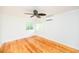 Spacious bedroom with hardwood floors and ceiling fan at 105 Cooke St, Raleigh, NC 27601