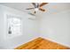 Bedroom with hardwood floors, ceiling fan and window at 105 Cooke St, Raleigh, NC 27601