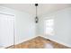 Simple dining room featuring a light wood floor and pendant lighting at 105 Cooke St, Raleigh, NC 27601
