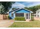 Charming blue house with screened porch and well-manicured lawn at 105 Cooke St, Raleigh, NC 27601