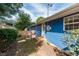 Rear view of blue house with side yard at 105 Cooke St, Raleigh, NC 27601