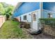 Blue house exterior with a white door and landscaping at 105 Cooke St, Raleigh, NC 27601