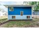 Blue house exterior with multiple windows and a yard at 105 Cooke St, Raleigh, NC 27601