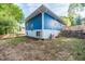 Blue house with a fenced backyard and landscaping at 105 Cooke St, Raleigh, NC 27601