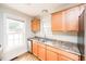 Updated kitchen with stainless steel sink and light wood cabinets at 105 Cooke St, Raleigh, NC 27601