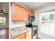 Modern kitchen with stainless steel appliances and granite countertops at 105 Cooke St, Raleigh, NC 27601