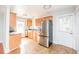 Efficient kitchen with stainless steel appliances and wood cabinets at 105 Cooke St, Raleigh, NC 27601