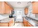 Bright kitchen features stainless steel appliances and light wood cabinets at 105 Cooke St, Raleigh, NC 27601