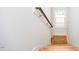 Clean staircase with wooden steps and railing at 105 Cooke St, Raleigh, NC 27601